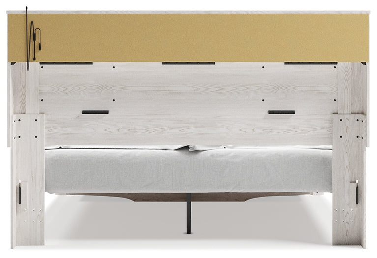 Cama-librería tapizada Altyra con espacio de almacenamiento