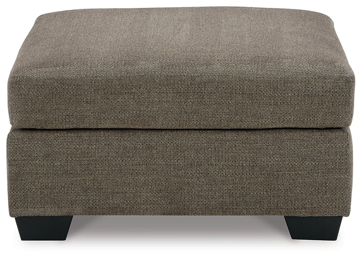 Ashley Express - Otomana extragrande con acento Mahoney