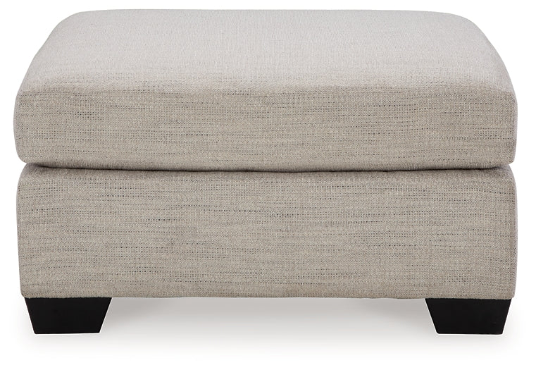 Ashley Express - Otomana extragrande con acento Mahoney