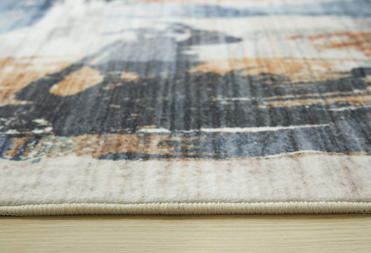 Ashley Express - Alfombra lavable mediana Hessland