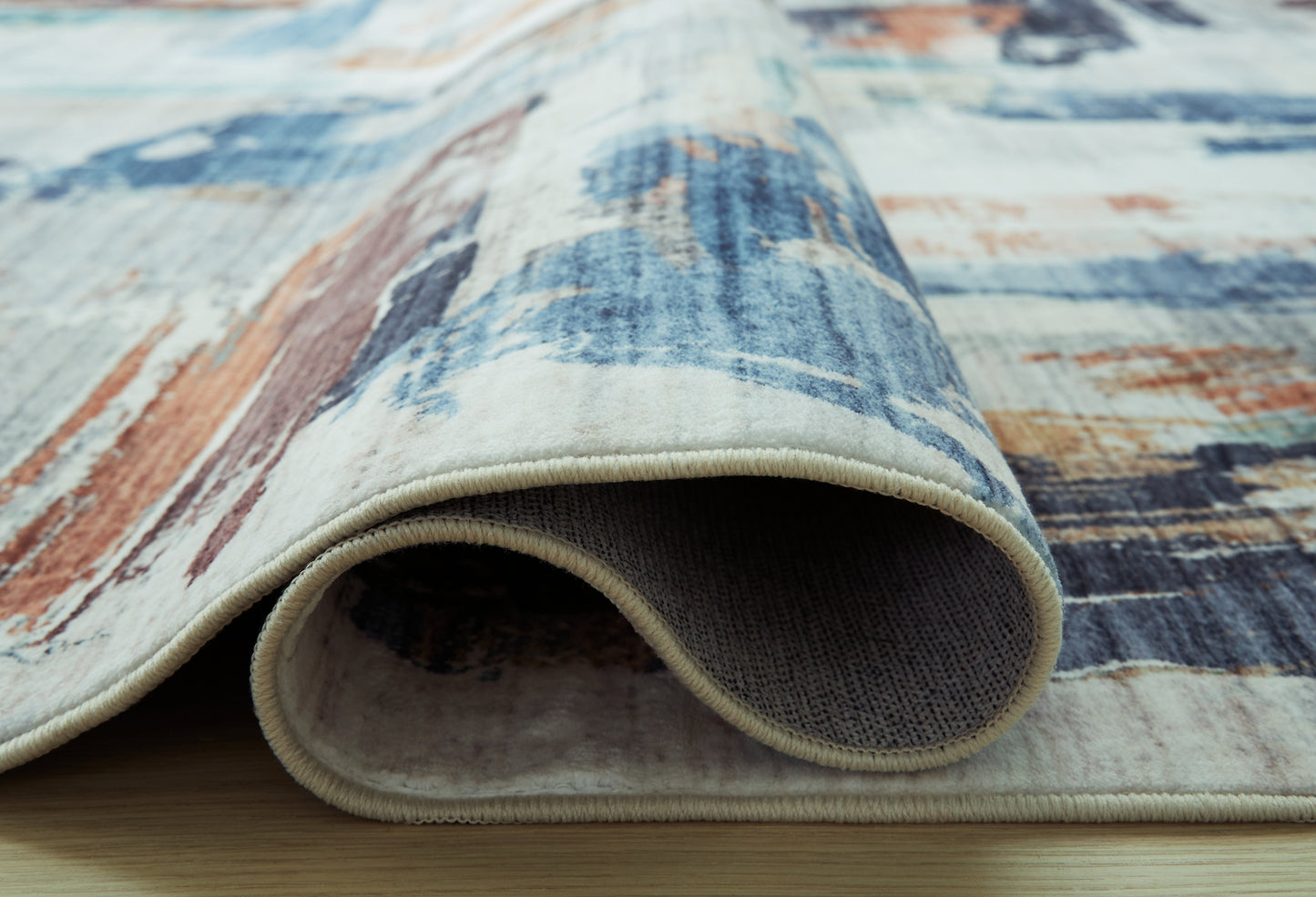 Ashley Express - Alfombra lavable mediana Vinlett