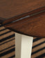 Ashley Express - Mesa de comedor Woodanville y dos sillas