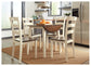 Ashley Express - Mesa de comedor Woodanville y 4 sillas