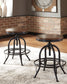 Ashley Express - Mesa de comedor Valebeck de altura de mostrador y 4 taburetes