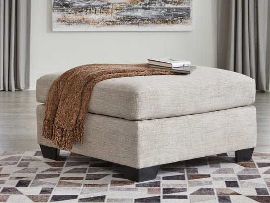Ashley Express - Otomana extragrande con acento Mahoney