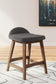 Ashley Express - Mesa de comedor Lyncott de altura de mostrador y 4 taburetes
