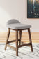 Ashley Express - Mesa de comedor Lyncott de altura de mostrador y 4 taburetes