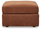 Ashley Express - Otomana extragrande con acento Modmax