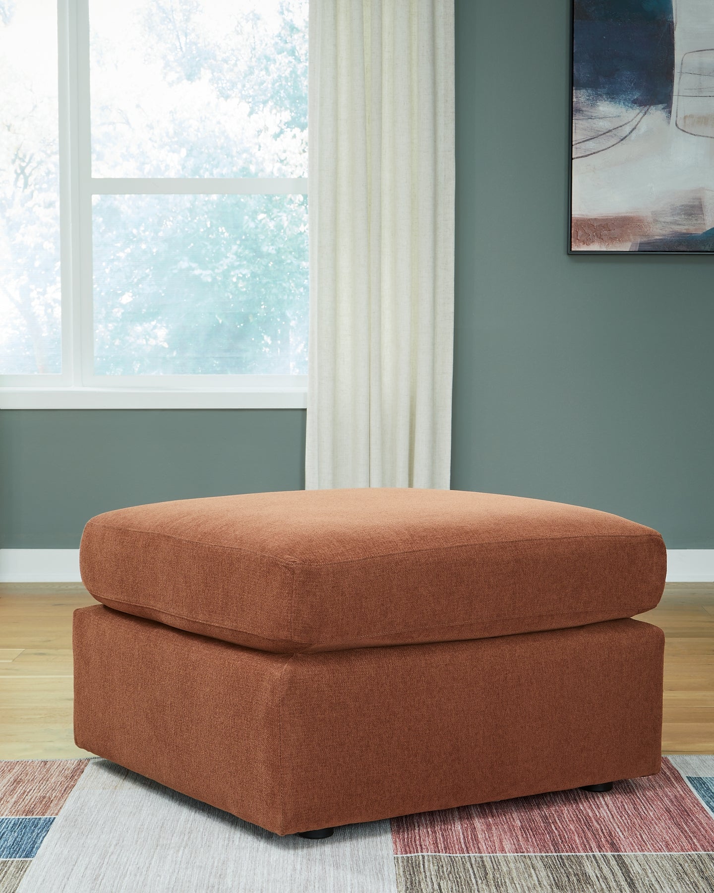 Ashley Express - Otomana extragrande con acento Modmax