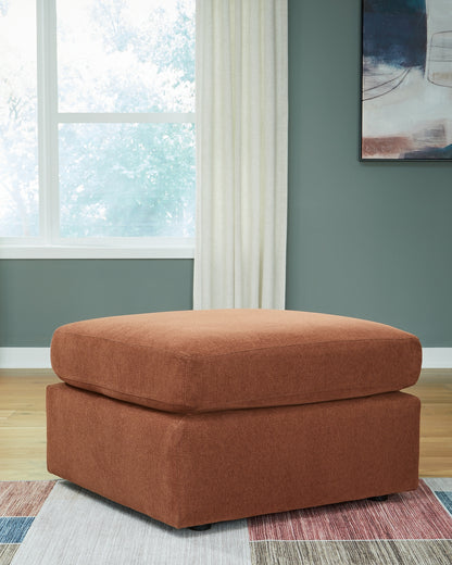 Ashley Express - Otomana extragrande con acento Modmax
