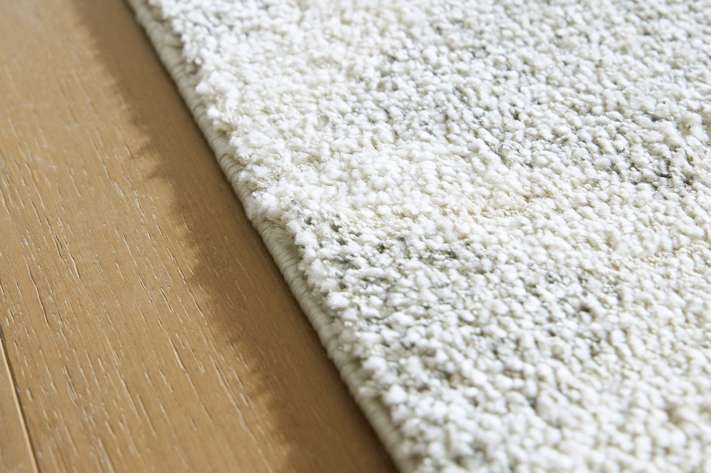 Ashley Express - Alfombra mediana Unawick