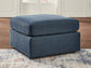 Ashley Express - Otomana extragrande con acento Modmax