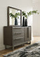 Cama Arkenton California King con paneles y tocador con espejo