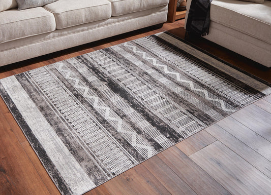 Ashley Express - Alfombra lavable mediana Henchester